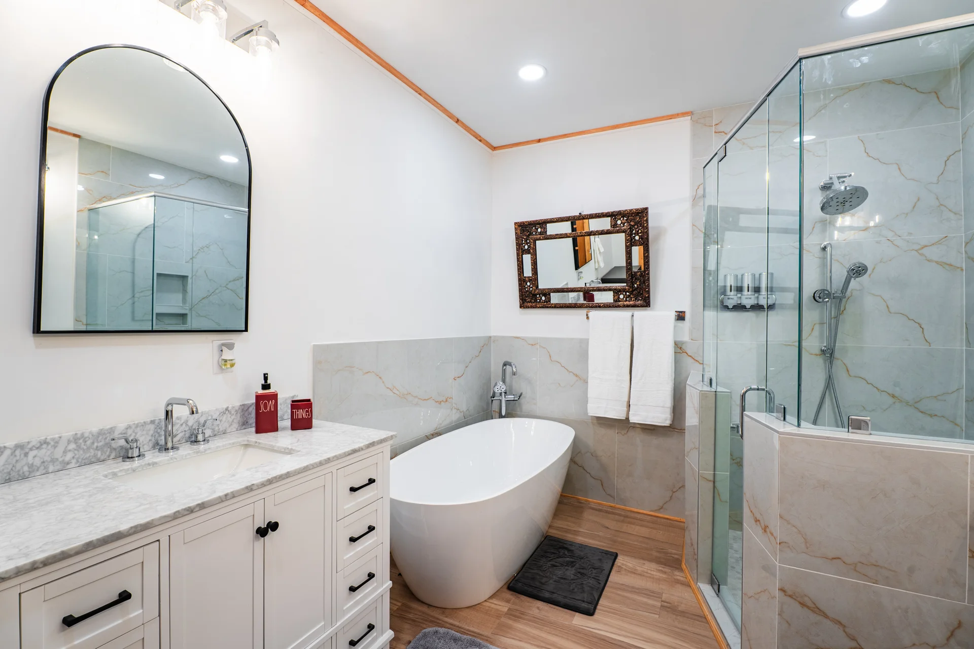 Spa bathroom with deep soaking tub and walk-in shower
